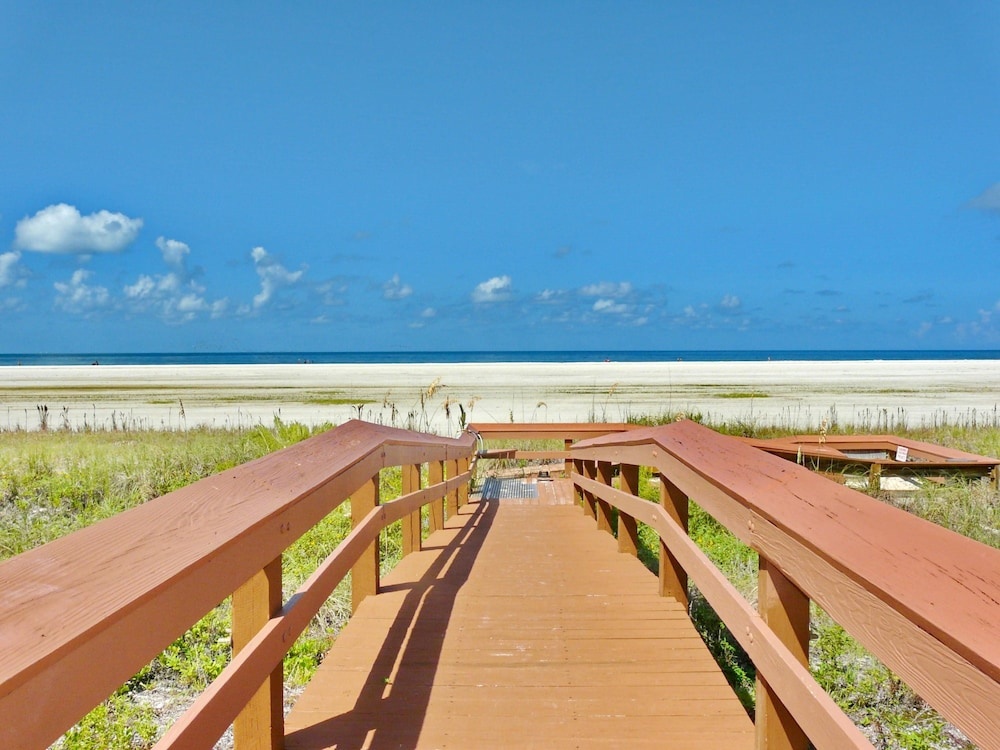 Inviting Beachfront Condo With Large Balcony and Pool