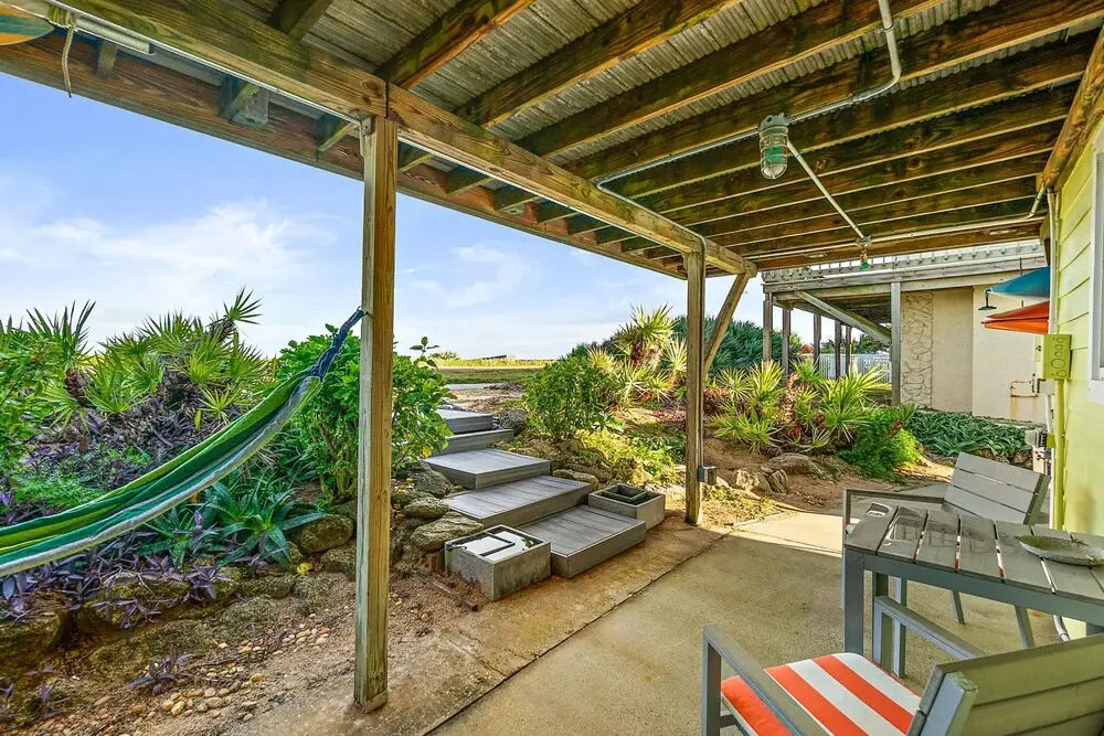 Tropical Beach Bungalow by Teeming Vacation Rentals
