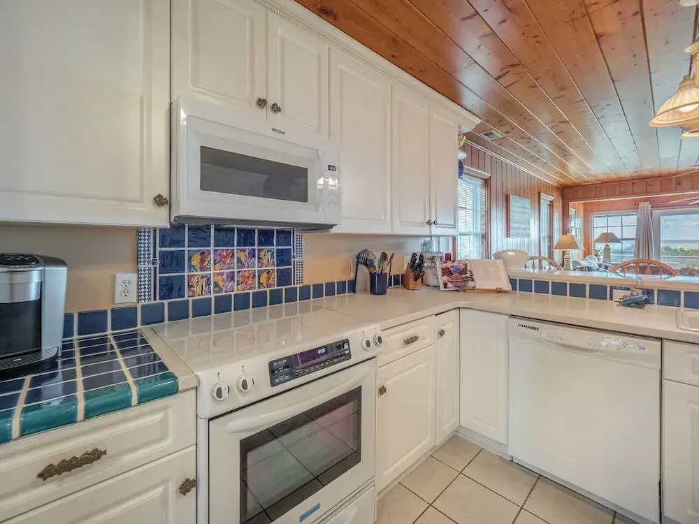 A Charm of Finches by Topsail Realty