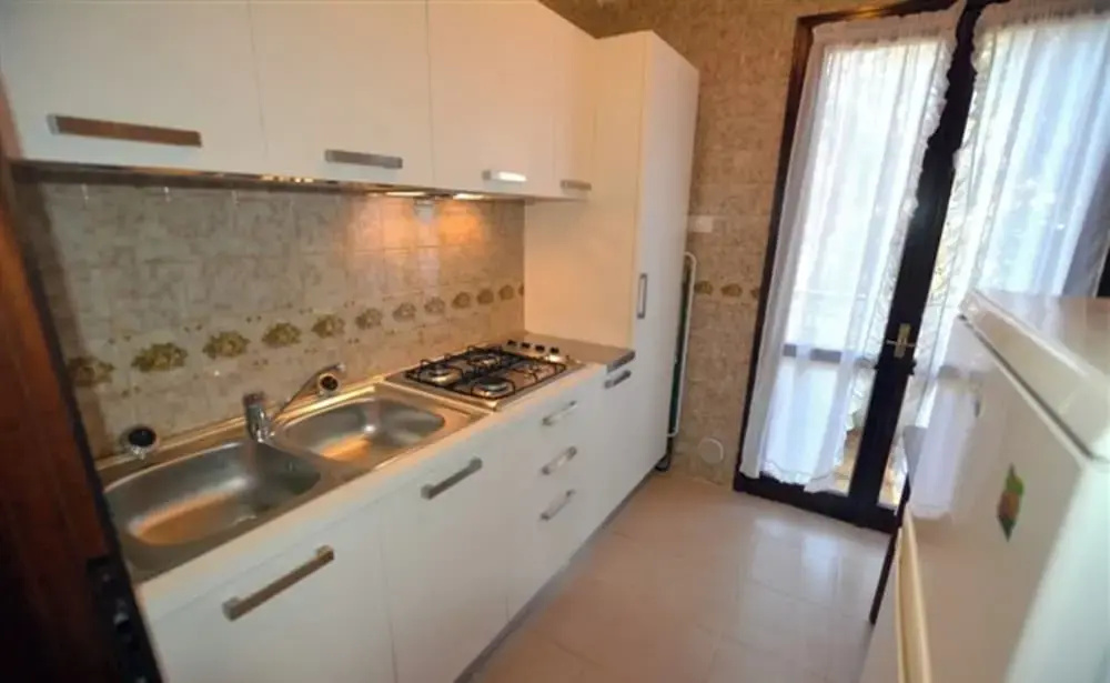 Large row House With Private Fenced Garden for 10 Guests in Lignano Pineta