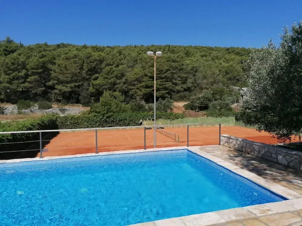 Tennis court and outdoor pool villa
