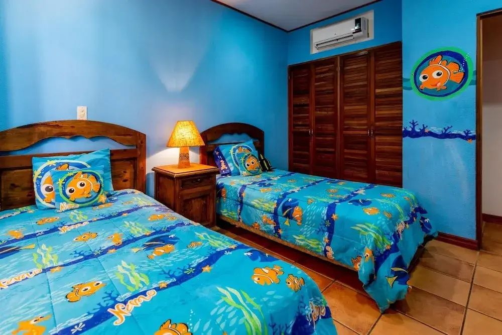 Beachfront Condo with Warm, Rustic Interiors & Direct Access to Playa Flamingo