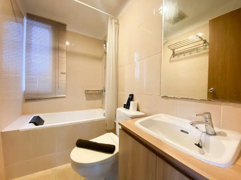 Cozy and Minimalist 2BR at 8th Floor The Oasis Cikarang Apartment By Travelio