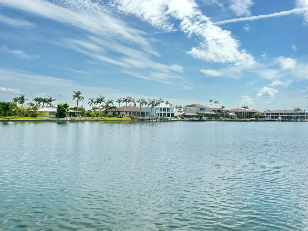 Waterfront home with views, pool and walk to beach
