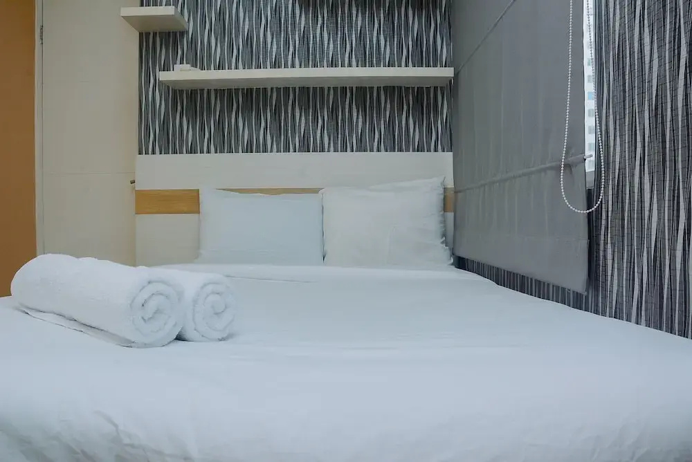 Minimalist 1BR with Pool View at Bassura City Apartment