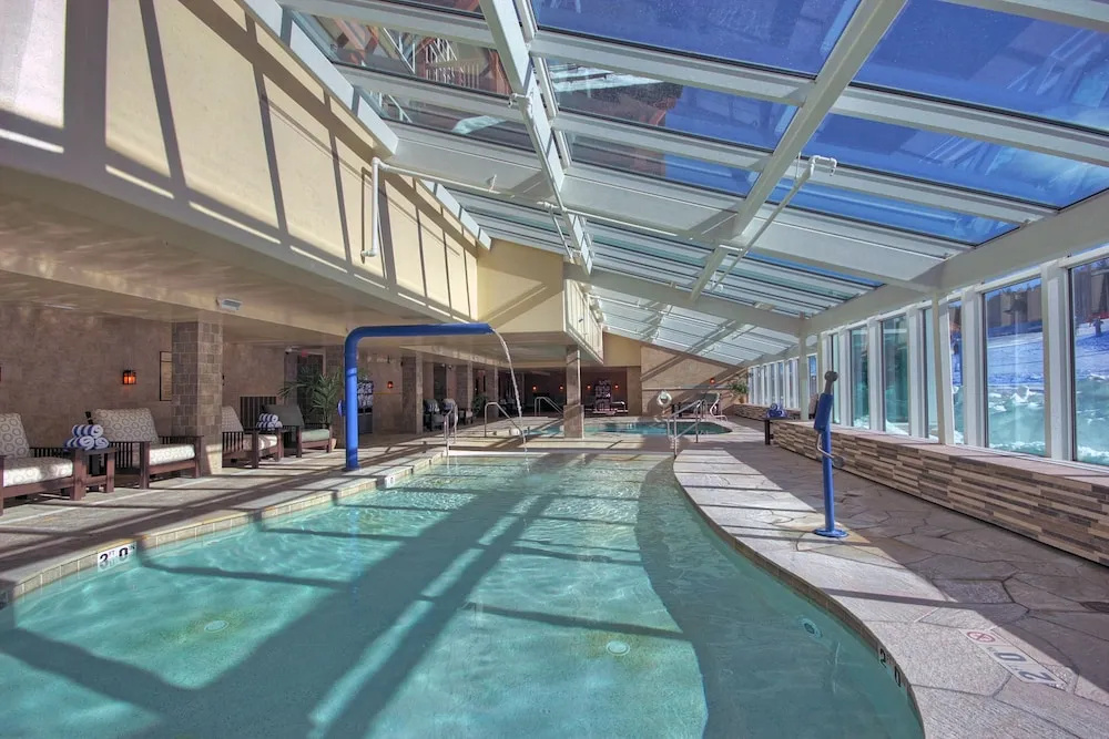 Luxury  At Base Of Peak 8, Steps From Winter Activities 2 Bedroom Condo by RedAwning
