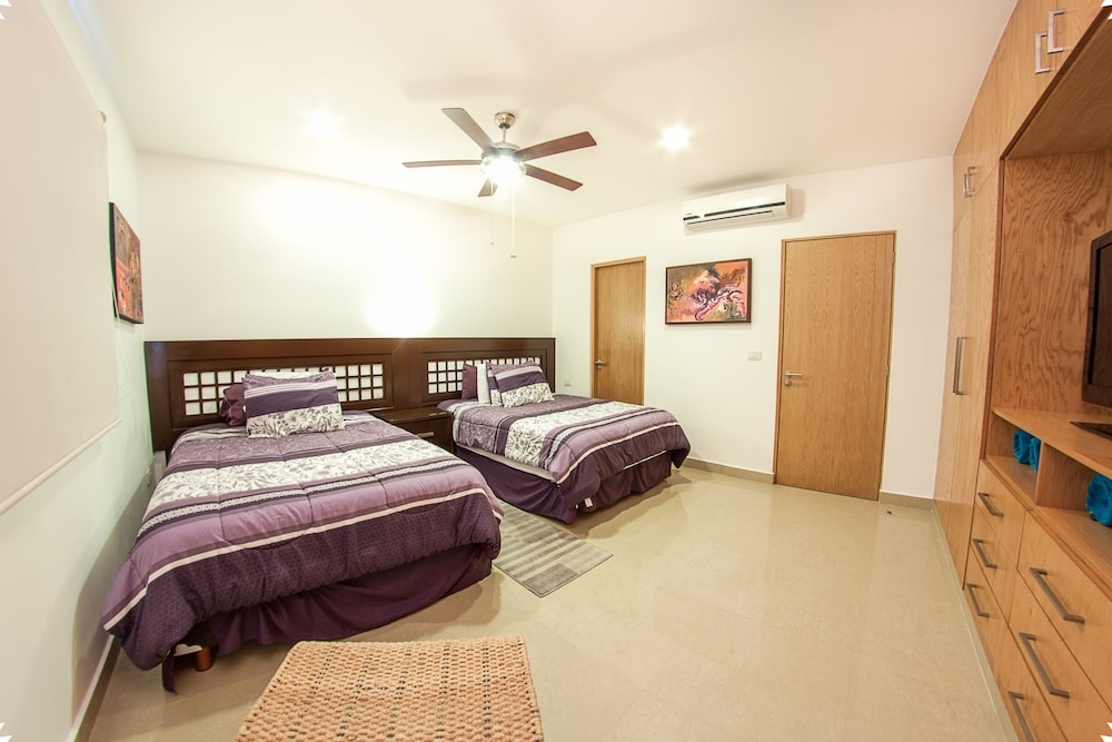 Fun and Relaxing  2BR PH steps away from the beach by Happy Address