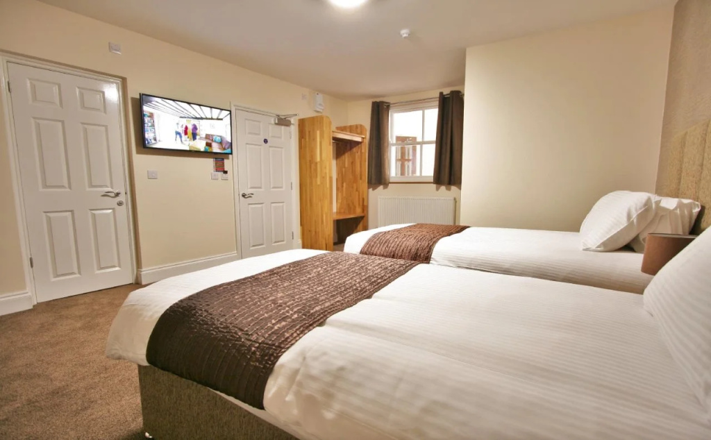 New County Hotel & Serviced Apartments by RoomsBooked