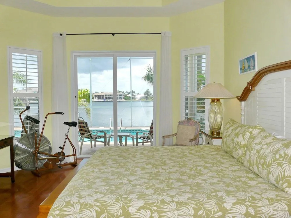 Waterfront home with views, pool and walk to beach