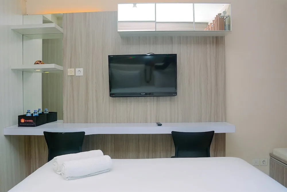 Homey and Cozy Living Studio Room at Tifolia Apartment By Travelio