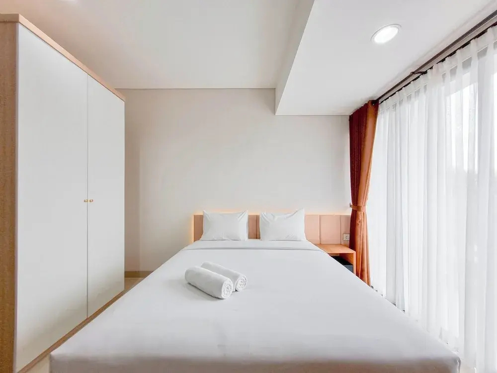 Homey Studio at Patraland Amarta Apartment By Travelio