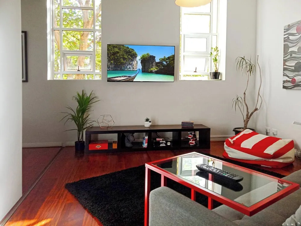 Unwind in Style at Melbourne's Historic Art Deco Apartment With Pool Gym Carpark