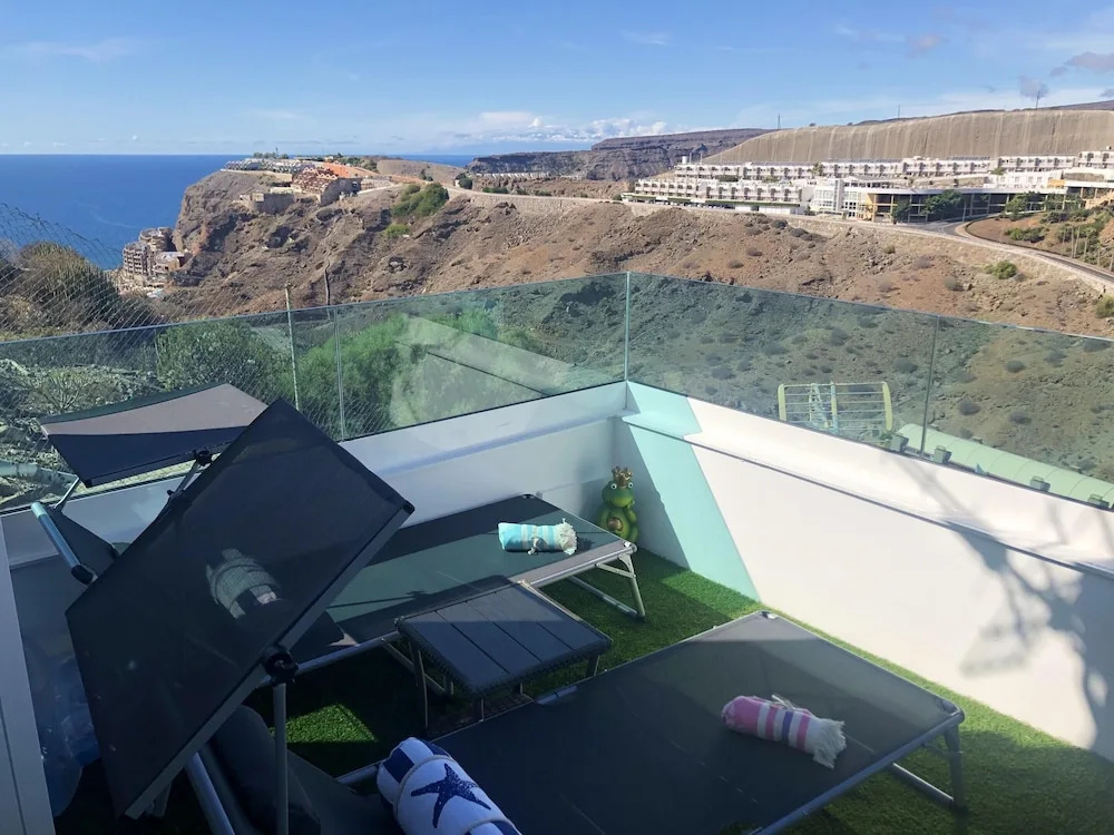 Apartment with 2 Bedrooms in Mogán, with Wonderful Sea View, Pool Access, Furnished Garden