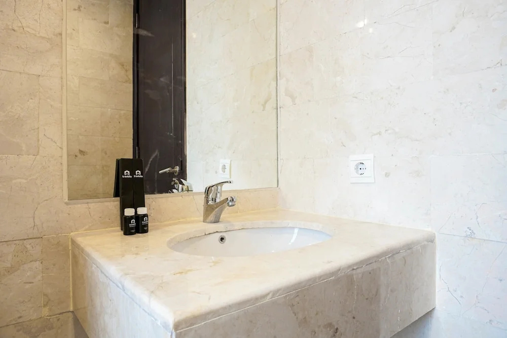 Cozy 2BR at Empyreal Epicentrum Apartment By Travelio