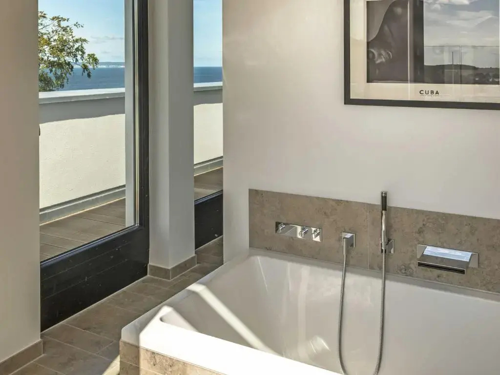Villa Philine - Penthouse 28 mit Panoramablick, Pool, SPA & Kamin