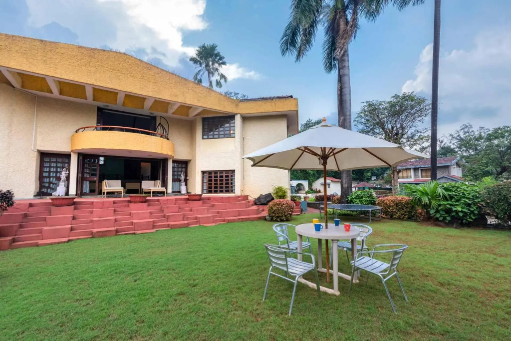 StayVista's Shantam House - Dive into relaxation with a pool and tennis lawn