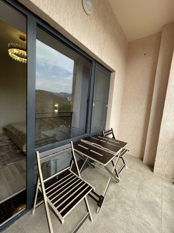 V Tsentre Goroda Apartments