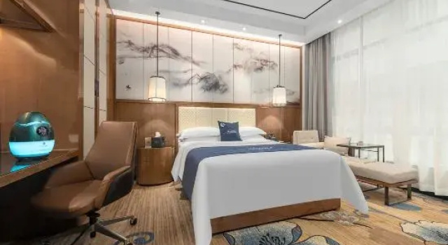 Кровать в общем номере Kamston International Hotel