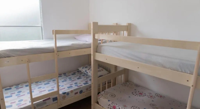 Кровать в общем номере Casa & Hospedagem Carol