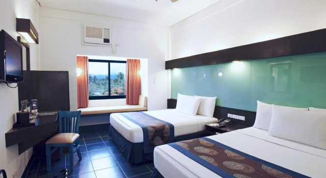 Четырёхместный номер Standard с видом на сад Microtel by Wyndham Puerto Princesa