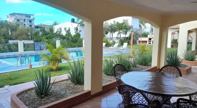 Serene 1-Bedroom Apartment with Shared Pool in Boca Chica, Забронировать Апартаменты/квартира Отели Большого Санто-Доминго с бассейном, Бассейн