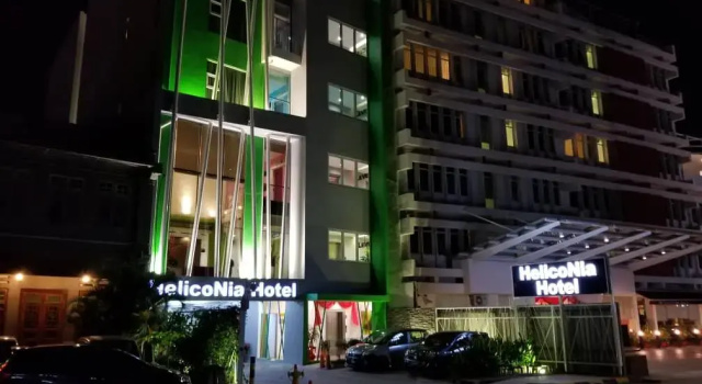 Łóżko w pokoju wieloosobowym Yan Hotel