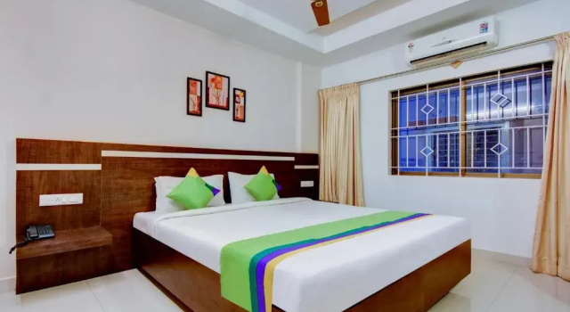 Treebo Primeland Suites, Забронировать Отель Tāvarikere штат Карнатака