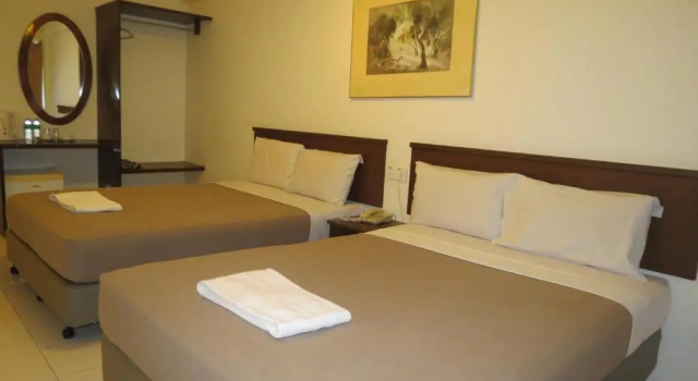 Standardowy czteroosobowy pokój Virgo Batik Resort Teluk Batik Lumut