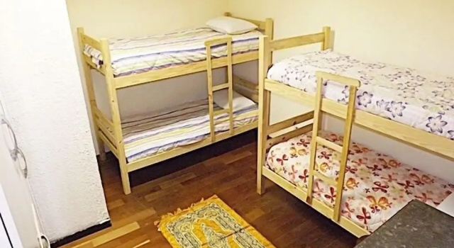 Кровать в общем номере Pousada Imigrantes Jabaquara