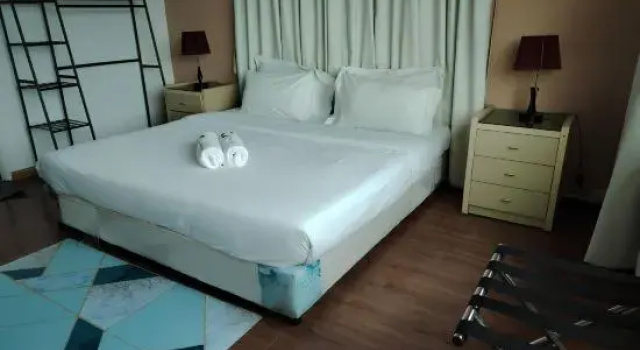 Кровать в общем номере Natol Homestay - Kuching Home Penthouse Airport Road