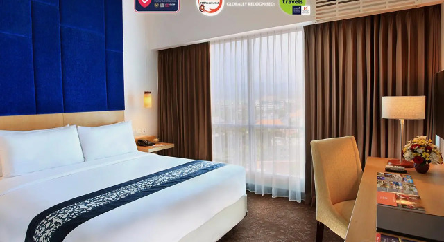 Postel ve společném pokoji Swiss-Belinn Malang