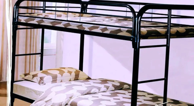 Кровать в общем номере Tribe Inn & Rooftop lounge
