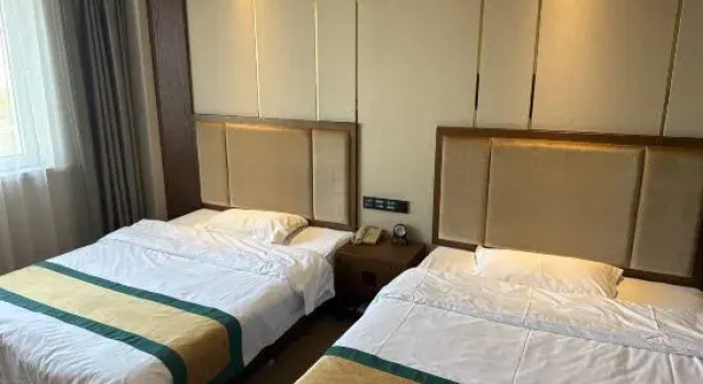 Кровать в общем номере Liaoyuan Hotel