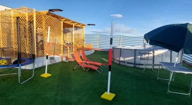 Cabaña con piscina, vista al Oasís de Pica., Забронировать Апартаменты/квартира Отели Tarapacá с парковкой, Парковка