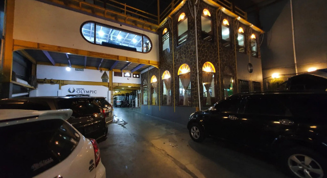 Giường trong phòng ngủ tập thể Hotel Olympic