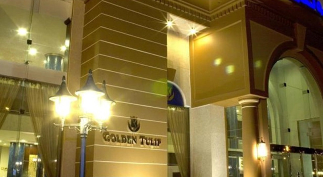 Кровать в общем номере Golden Tulip Al Khobar