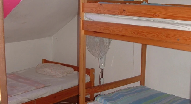 Кровать в общем номере ABC Guesthouse