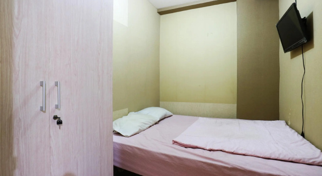 Кровать в общем номере Snowy@Apartemen Tifolia