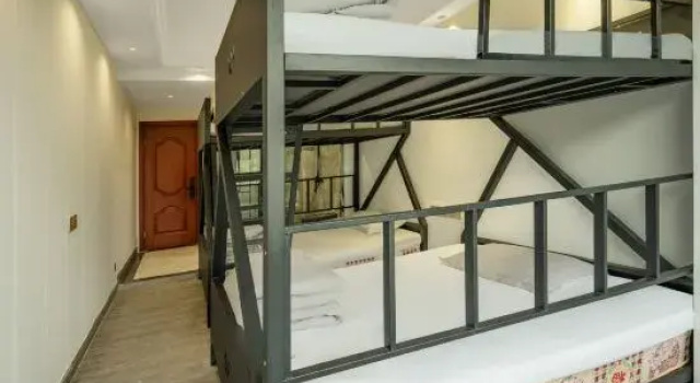 Кровать в общем номере Shang 9 Hotel