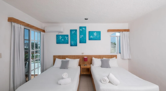 Четырёхместный номер Deluxe с частичным видом на океан HOTEL & BEACH CLUB OJO DE AGUA