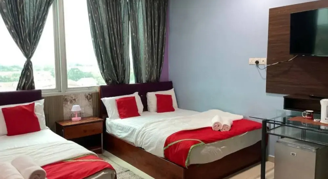 Четырёхместный семейный люкс Saujana City Hotel