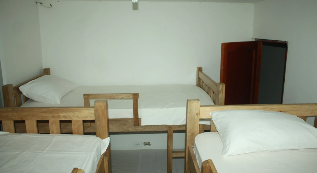Кровать в общем номере Hostal Casa Micaela